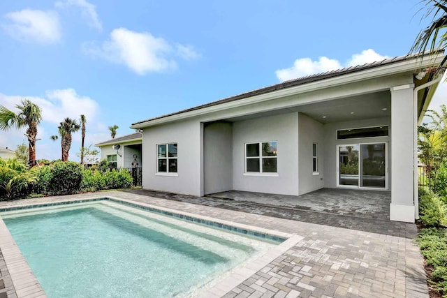 rear view of house featuring a patio