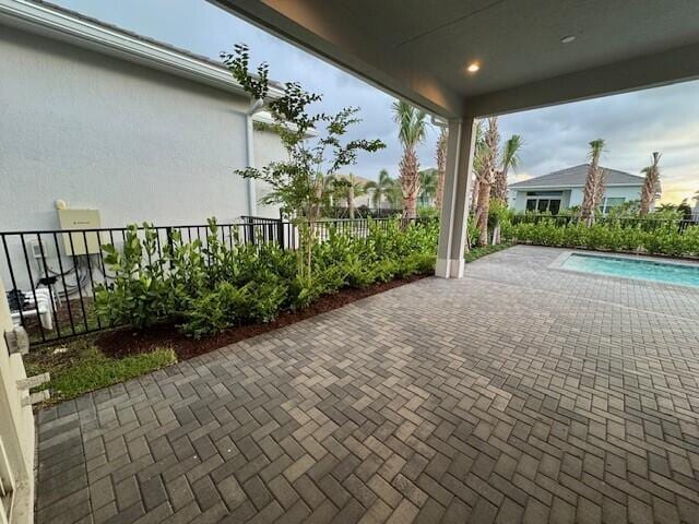 view of patio featuring a fenced in pool