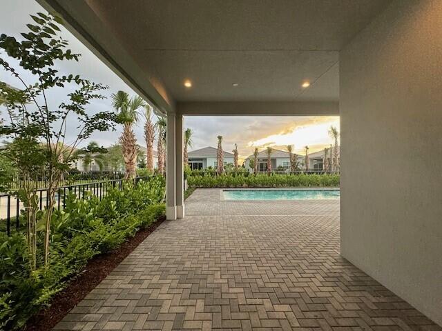 view of patio / terrace with a fenced in pool