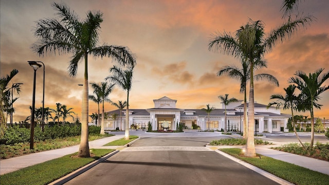 view of outdoor building at dusk