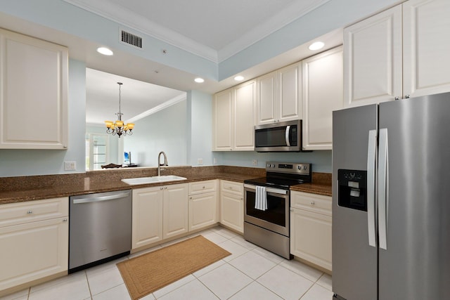 kitchen featuring sink, a notable chandelier, stainless steel appliances, light tile patterned floors, and crown molding