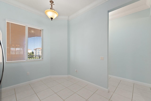 tiled empty room featuring ornamental molding