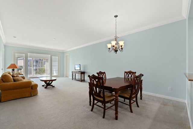 dining area with light colored carpet, a notable chandelier, and crown molding