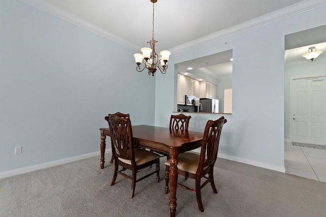 dining room featuring light carpet, a notable chandelier, and ornamental molding