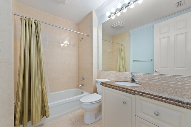 full bathroom with shower / bath combo with shower curtain, vanity, a textured ceiling, toilet, and tile patterned floors