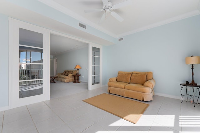 living room featuring ceiling fan, light tile patterned floors, and ornamental molding