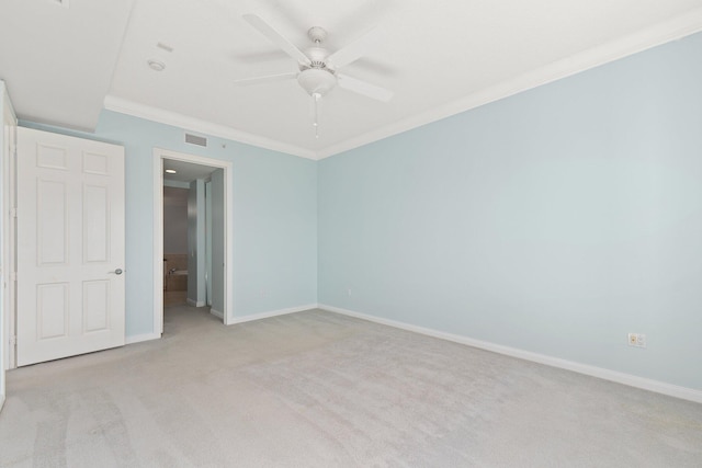 unfurnished bedroom featuring light carpet, crown molding, and ceiling fan