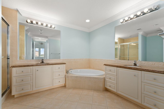 bathroom featuring ornamental molding, vanity, plus walk in shower, and tile patterned floors