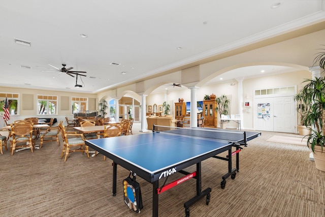 playroom featuring carpet floors, crown molding, decorative columns, and ceiling fan