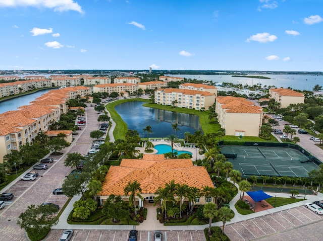 birds eye view of property featuring a water view