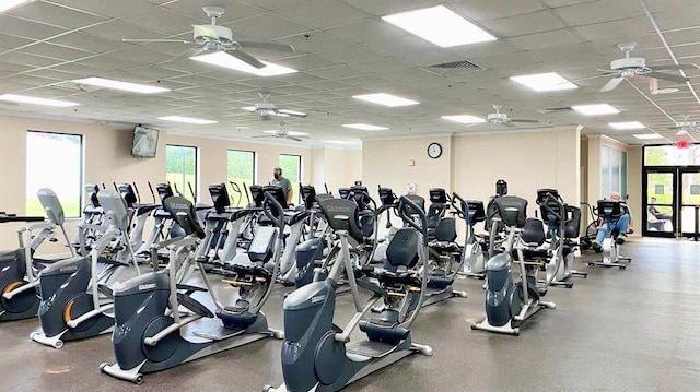 workout area featuring a drop ceiling and ceiling fan