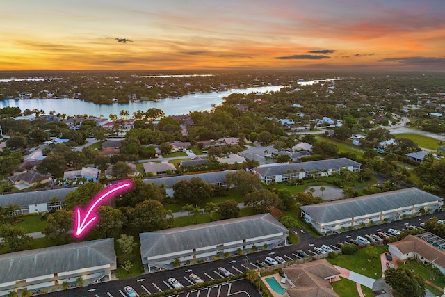 aerial view at dusk with a water view