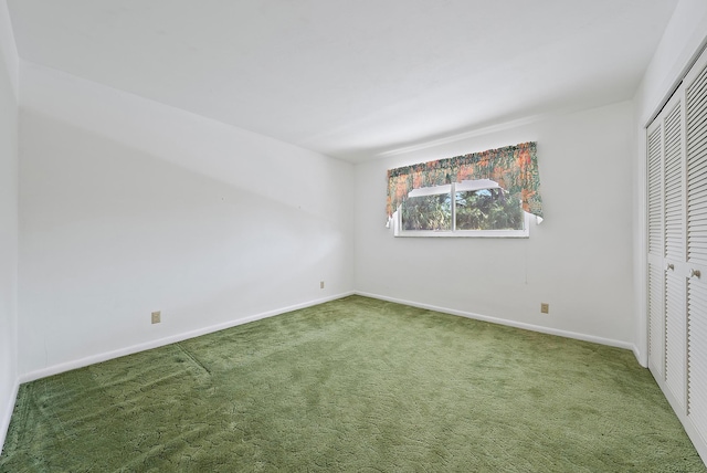 unfurnished bedroom with a closet and carpet flooring