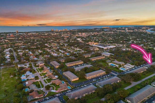 aerial view at dusk with a water view