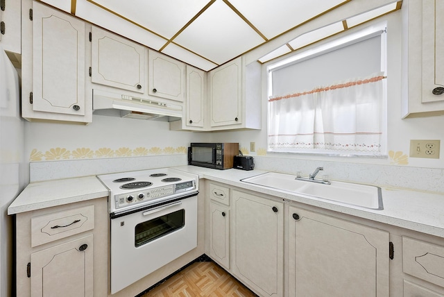 kitchen with white range with electric cooktop, sink, and light parquet flooring