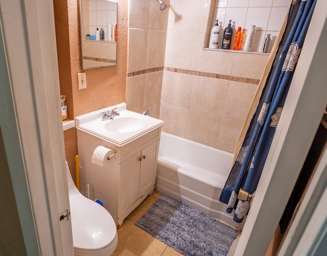 full bathroom featuring vanity, toilet, shower / bath combo with shower curtain, and tile patterned floors