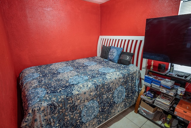 bedroom featuring light tile patterned floors