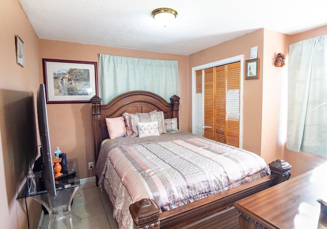 bedroom featuring a closet and tile patterned floors