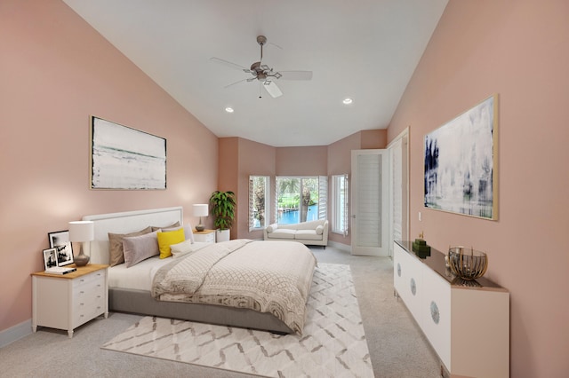 bedroom featuring ceiling fan, lofted ceiling, and light carpet