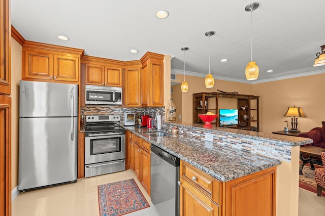 kitchen featuring pendant lighting, ornamental molding, kitchen peninsula, backsplash, and appliances with stainless steel finishes