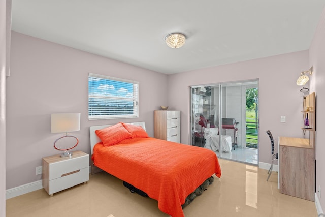 bedroom featuring access to outside and light tile patterned flooring