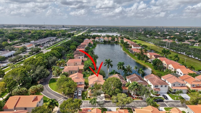 birds eye view of property featuring a water view