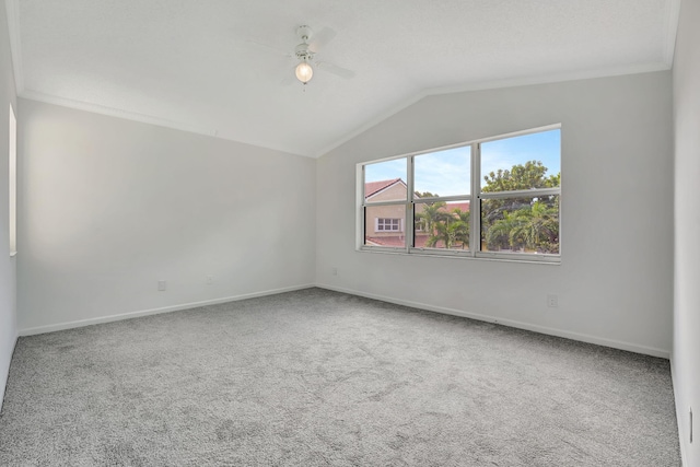 carpeted empty room with ceiling fan and lofted ceiling