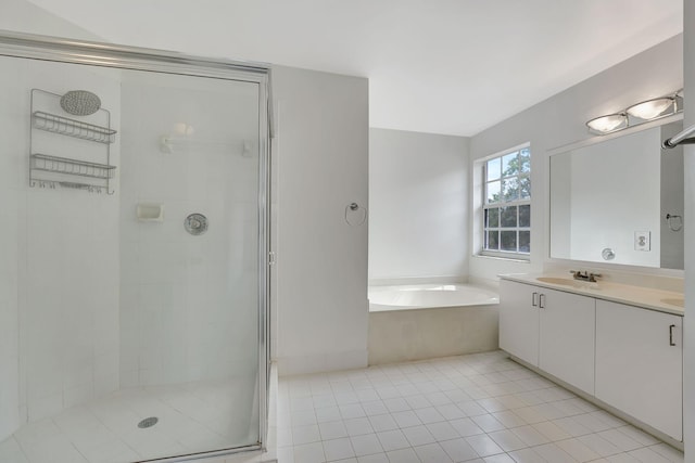 bathroom featuring tile patterned floors, vanity, and independent shower and bath