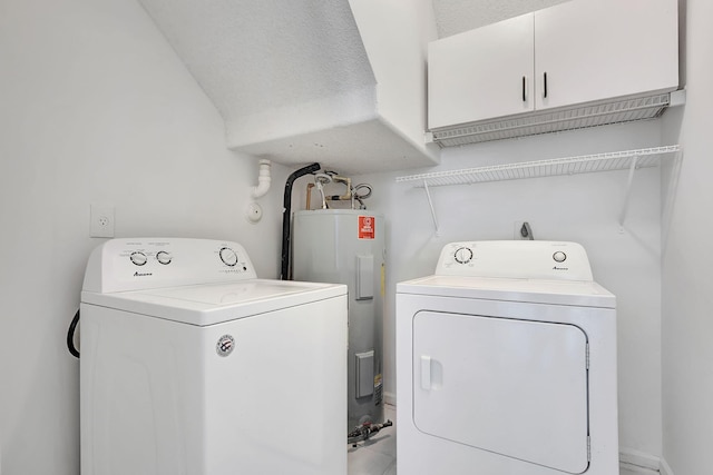 washroom with separate washer and dryer, a textured ceiling, and water heater