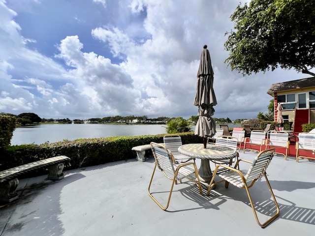 view of patio featuring a water view