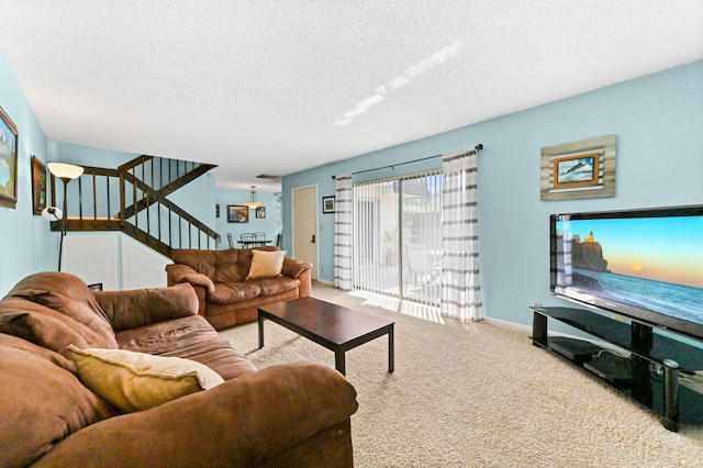 carpeted living room with a textured ceiling