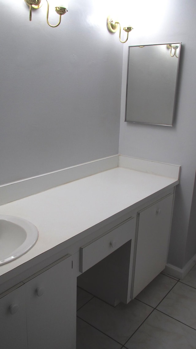 bathroom with tile patterned flooring and vanity