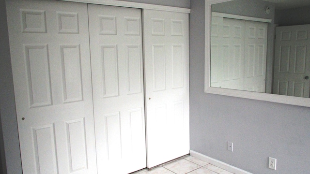 unfurnished bedroom with light tile patterned floors