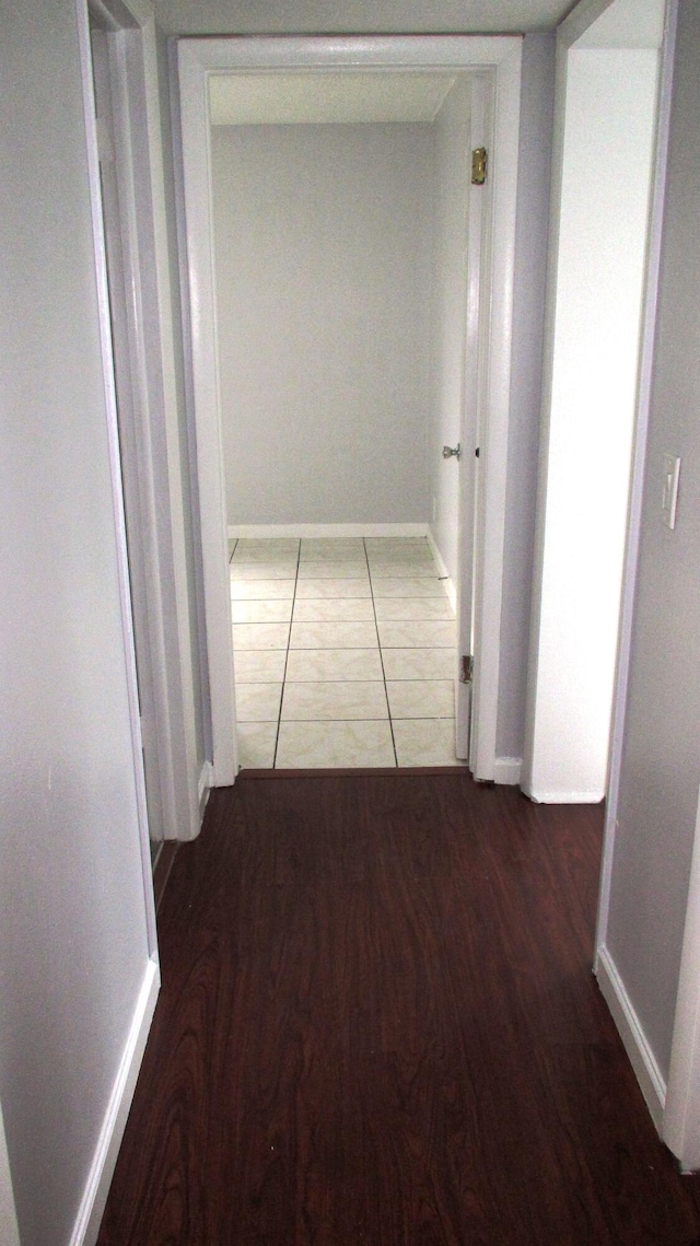 hallway featuring dark hardwood / wood-style flooring