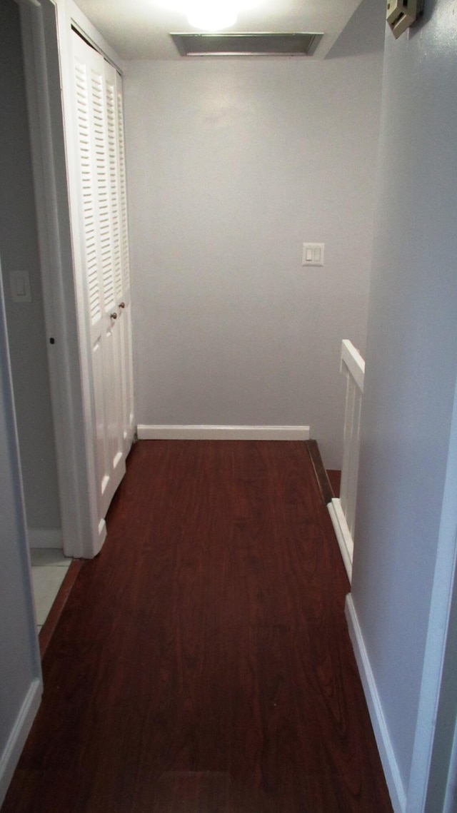 hall with dark hardwood / wood-style floors