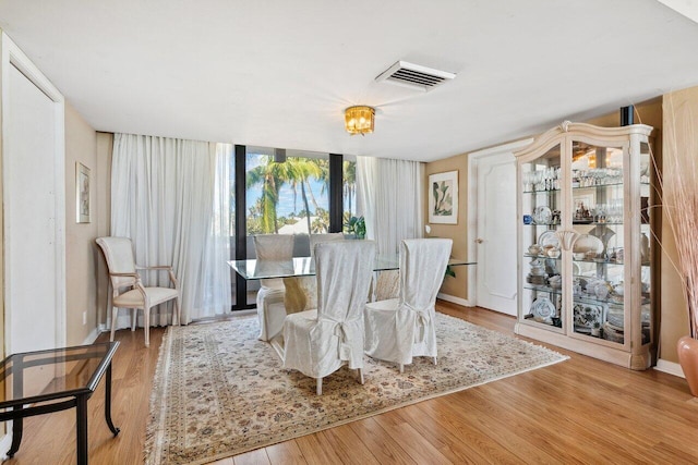 dining space with light wood-type flooring