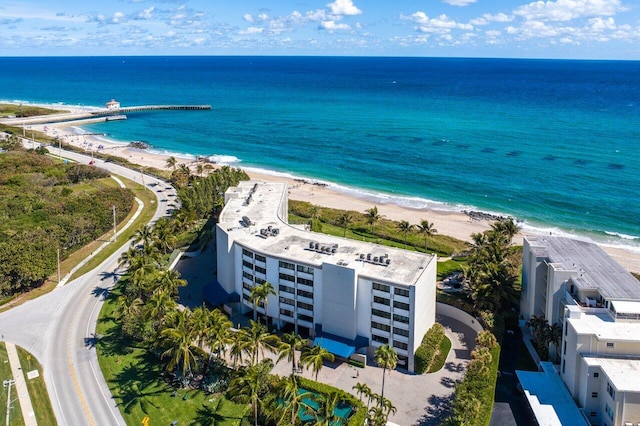 drone / aerial view with a view of the beach and a water view