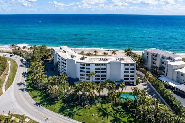 birds eye view of property with a view of the beach and a water view