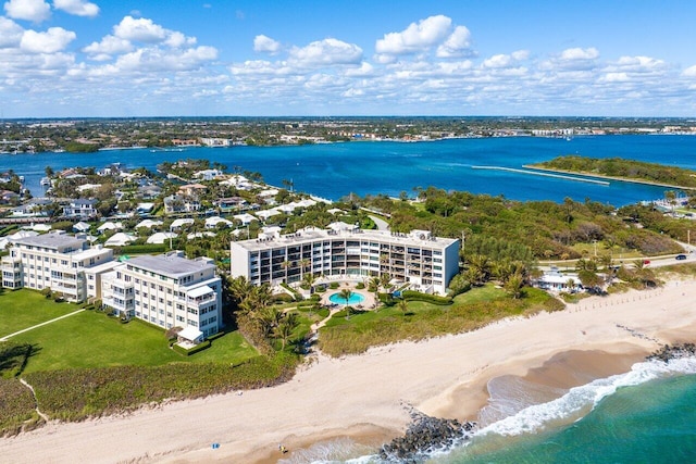 bird's eye view with a water view and a view of the beach