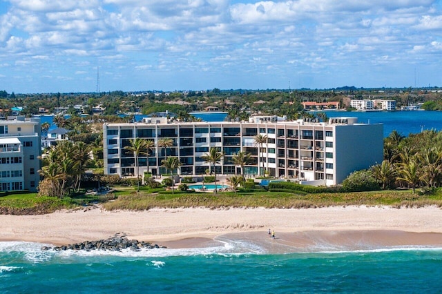 bird's eye view featuring a view of the beach and a water view