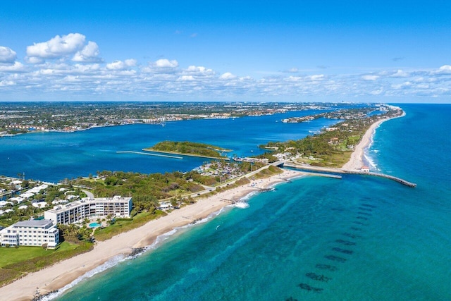 bird's eye view featuring a water view and a view of the beach