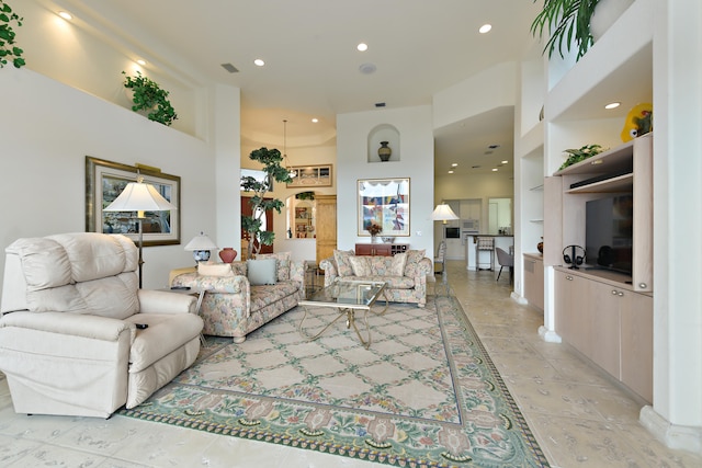 living room featuring a high ceiling