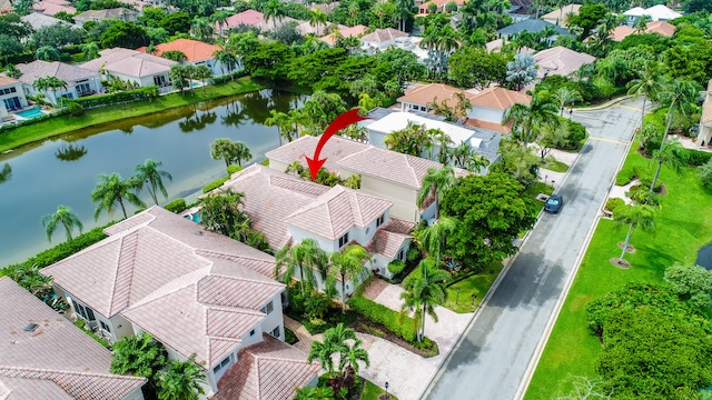 birds eye view of property with a water view