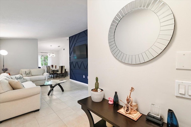 living room with light tile patterned flooring and a textured ceiling