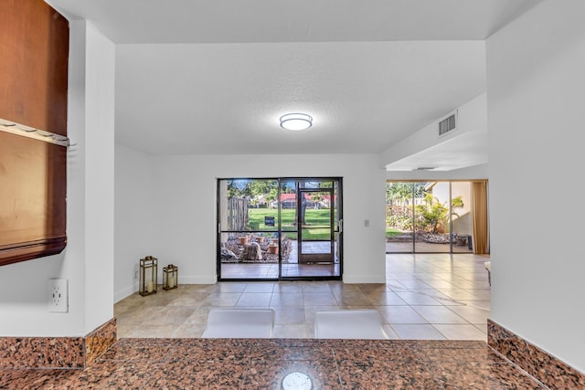 interior space featuring a textured ceiling