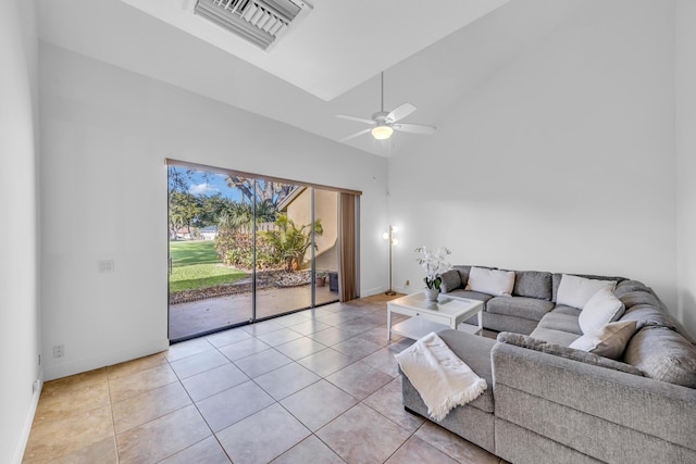 tiled living room with high vaulted ceiling and ceiling fan