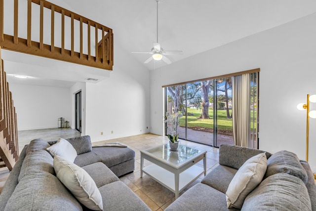 living room featuring high vaulted ceiling, light tile patterned floors, and ceiling fan