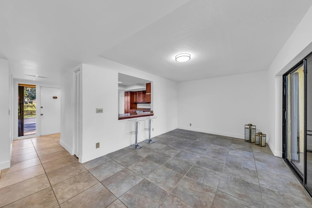 unfurnished living room with a textured ceiling