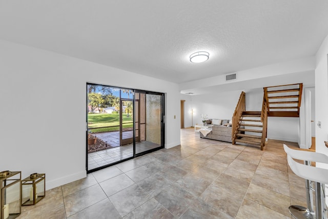 interior space with a textured ceiling