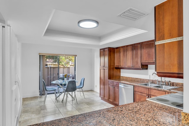 kitchen with dishwasher, sink, light tile patterned flooring, and a tray ceiling